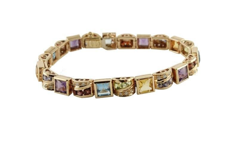 14 Kt Rose Gold Bracelet With Yellow and Blue Topazs, Peridots, Amethysts & Diamonds