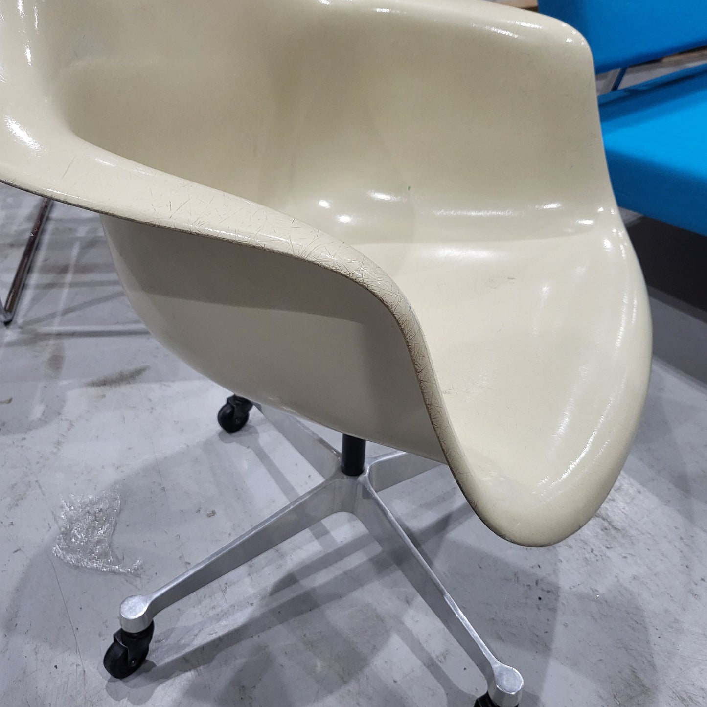 Eames Fiberglass Pacc Armchair with castors