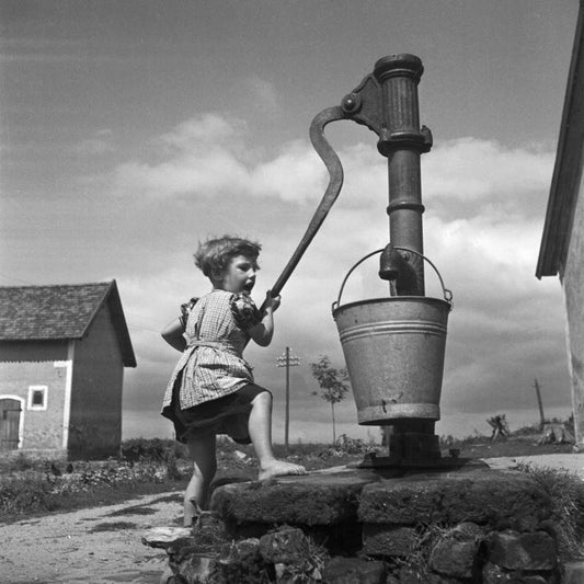 A Girl Taking Water from a Well, 1930, Photographic Print