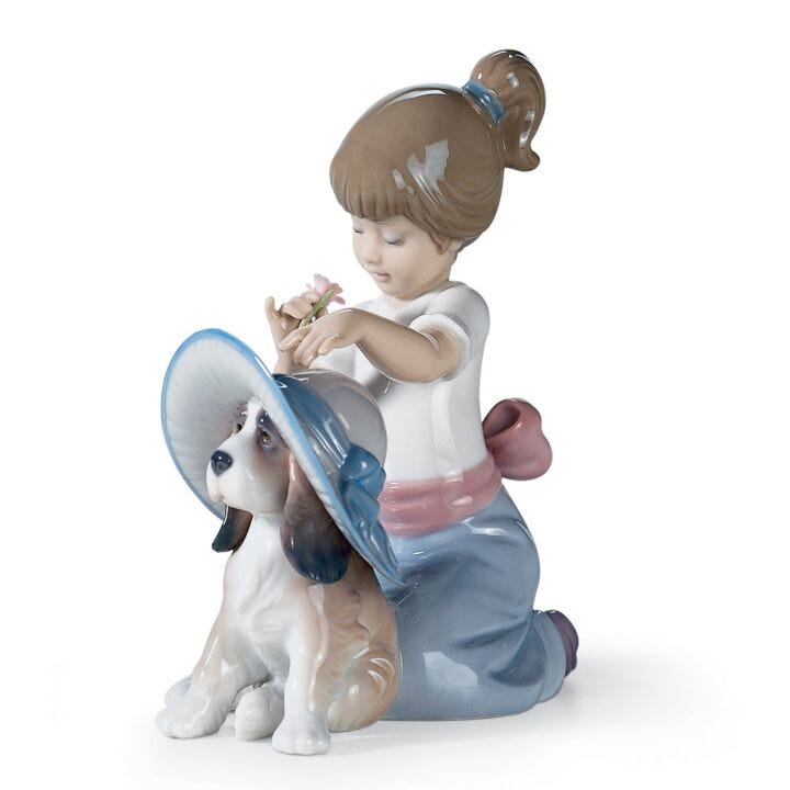 An Elegant Touch Girl Figurine by Lladró