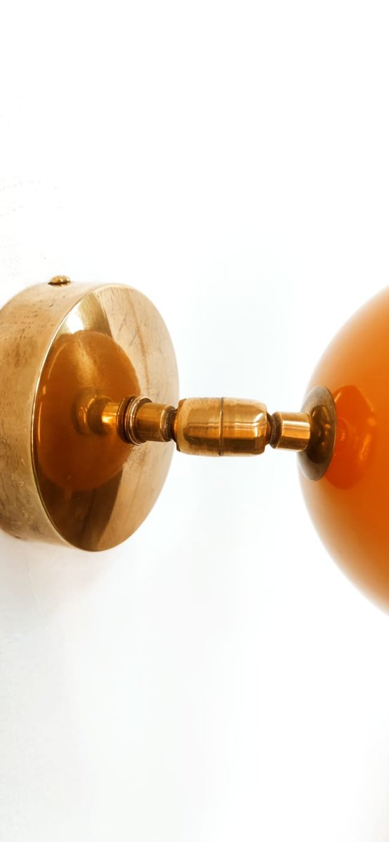 Adjustable Sconce with Orange Metal Dome