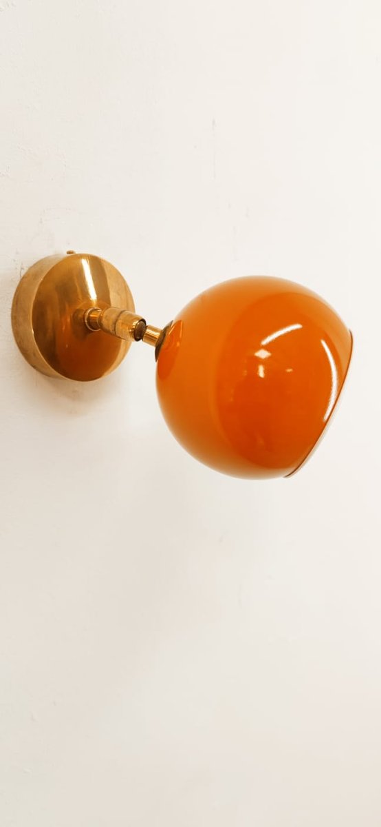 Adjustable Sconce with Orange Metal Dome