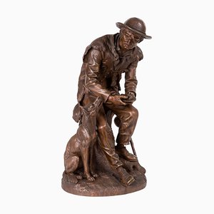 Anatole J. Guillot, Depicting Seated Woodcarver with Dog, Bronze Sculpture-RCE-1099681