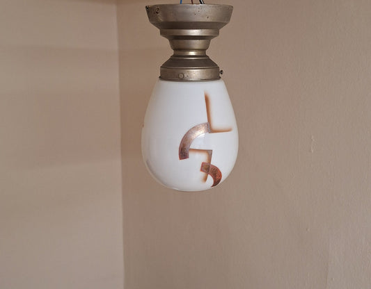 Art Deco German Ceiling Lamp with Teardrop-Shaped White Glass Shade with Orange-Silver Geometric Spray Decorative Motif on Nickel-Plated Metal Mount from Zenith, 1920s