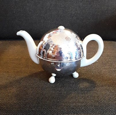 Art Deco German Cream White Porcelain Silver Plated Insulated Metal Coat with Cream White Bakelite Feet Spherical Tea Toan from WMF, 1930s-HOI-1335647