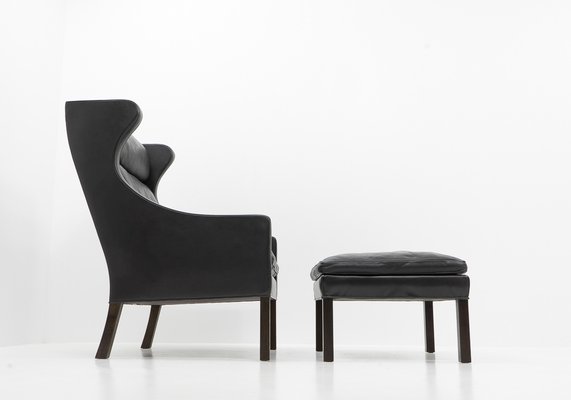 Black Leather Wingchair and Footstool by Borge Mogensen for Fredericia, 1960s, Set of 2-TJQ-1378679