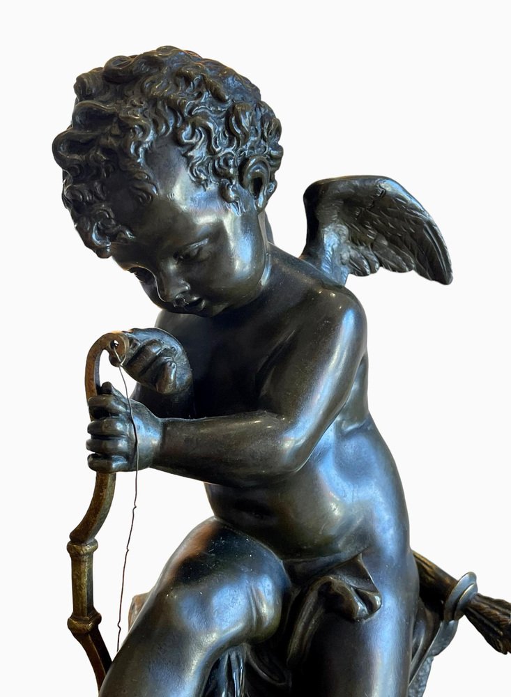 Bronze Cupid Tendant His Bow in the style of Charles Gabriel Sauvage