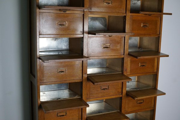 Dutch Oak Apothecary Filing Cabinet with Folding Doors, 1930s-XO-1158539