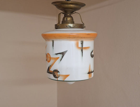 Flat Antique German Art Deco Ceiling Lamp from the 1920s with a White Glass Shade with an Orange Silver Geometric Spray Decorative Motif on an Original Brass Mount