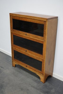 German Oak Bookcase with Folding Doors in Style of Globe Wernicke, 1930s-XO-1320887