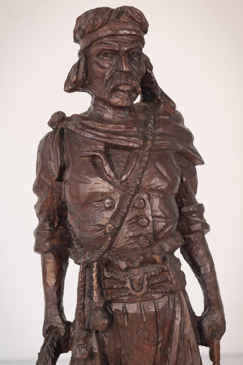 Hand-Carved Wooden Sculpture of a Male Figure