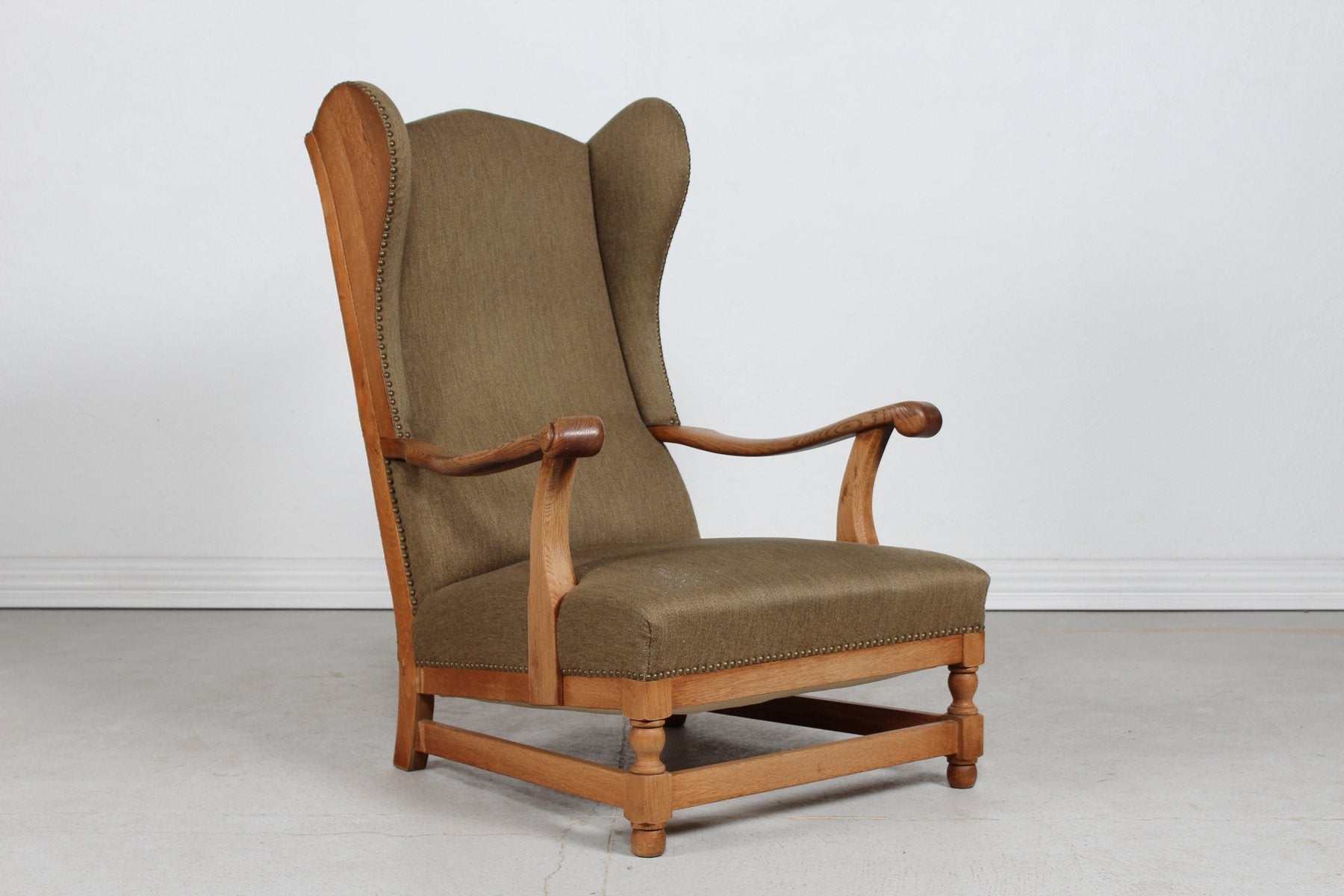 High Back King Chair in Oak with Greenish Wool by Axel Einar Hjorth, Denmark, 1940s