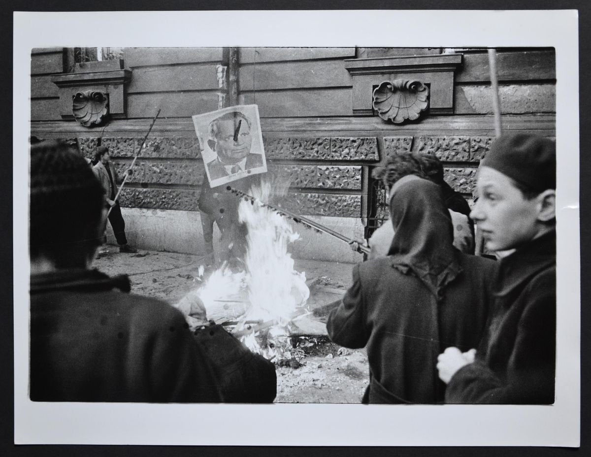 Hungary Uprising in Back a Fire with a Poster of Istvan Dobi, 1956