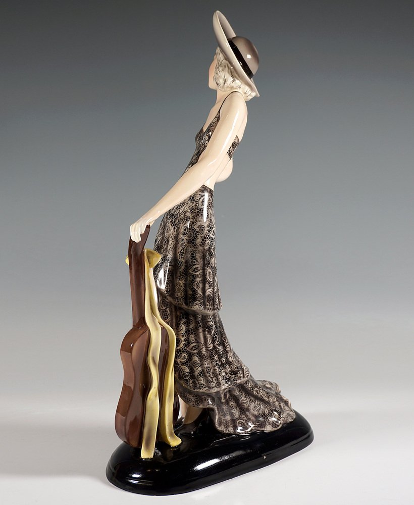 Lady with Hat and Guitar Figure attributed to Stephan Dakon for Goldscheider, Vienna, 1934