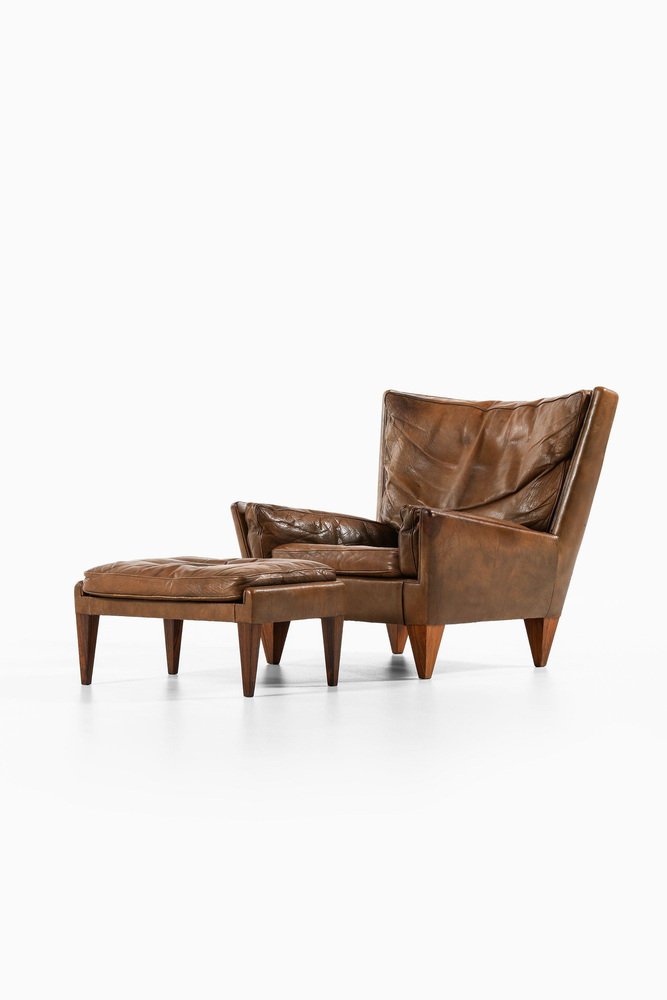 Lounge Chair and Stool in Rosewood and Brown Leather attributed to Illum Wikkelsø, 1960s, Set of 2