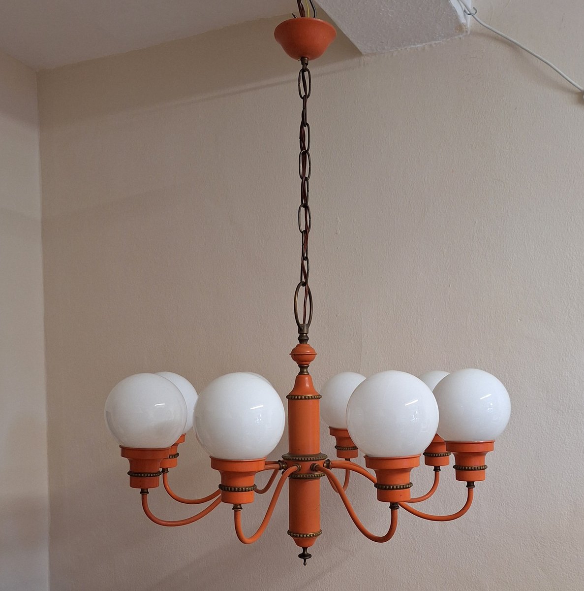 Mid-Century 8-Flame Chandelier with White Spherical Glass Shades on an Orange Frame, Set Off with Brass, 1960s