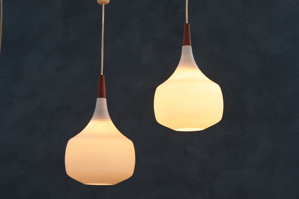 Mid-Century Danish Opaline Glass and Teak Pendant Lamps from Holmegaard, 1960s, Set of 2-ZGQ-712649