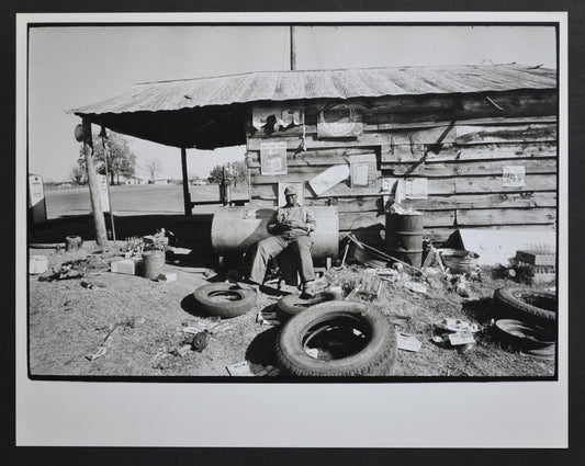 Mississippi Area Man Sitting in Front of His Hut by Rolf Gillhausen, US, 1960s