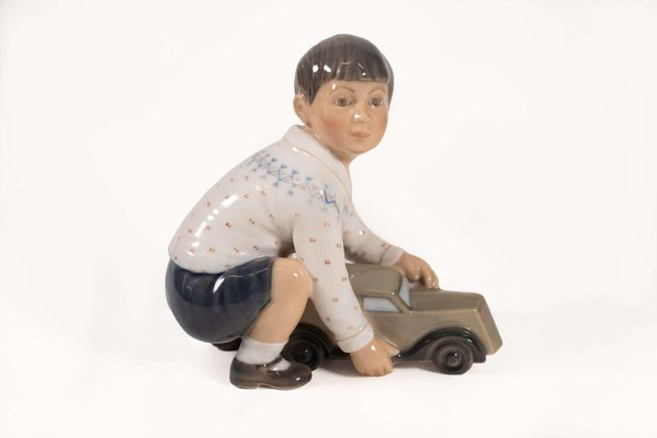 Model 1166 Boy with Car Figurine in Porcelain by Dahal Jensen, Denmark, 1950s-PCO-1813295