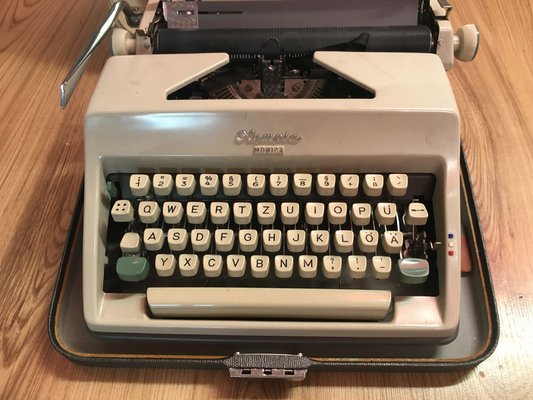 Olympia Monica Typewriter with Suitcase, 1960s