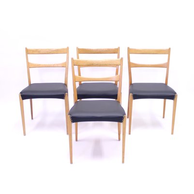 Scandinavian Oak Dining Chairs With Black Leather Seats, 1950s, Set of 4-KQ-787374