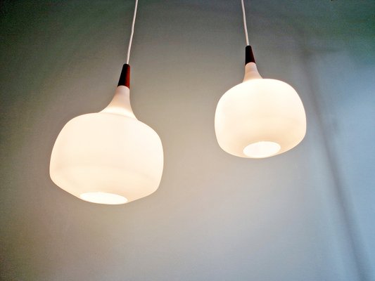 Scandinavian Pendant Lights in Teak and White Opaline Glass from Holmegaard, 1960s, Set of 2-FAX-2035873