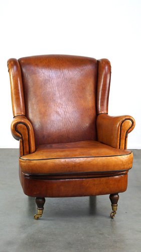 Sheep Leather Wing Chair on Brass Front Wheels