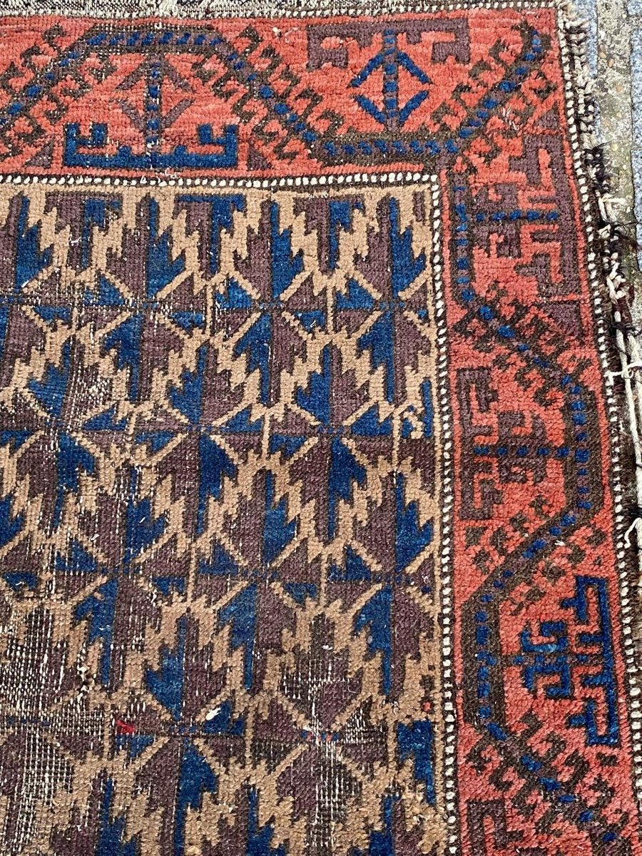 Small Antique Distressed Baluch Rug