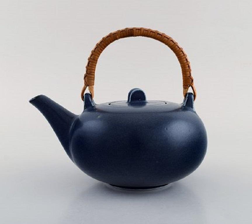 Teapot in Glazed Ceramic with Handle in Wicker by Eva Stæhr-Nielsen for Saxbo