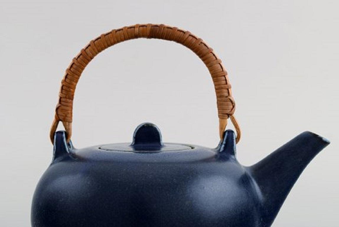 Teapot in Glazed Ceramic with Handle in Wicker by Eva Stæhr-Nielsen for Saxbo