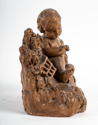 Terracotta Figurine of Child with Bird-WFS-1210976