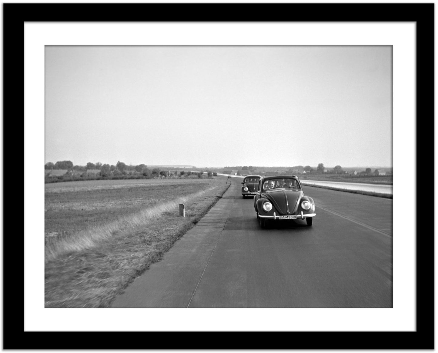 Two Volkswagen Beetles on the Highway, Germany, 1938