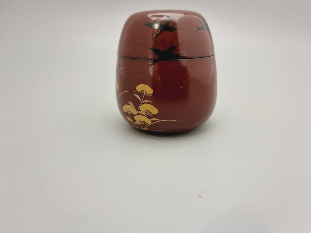 Vintage Japanese Netuske Matcha Container with Maki-E Lacquer in Maroon Colour with Black Cranes Over Golden Field, 1960s