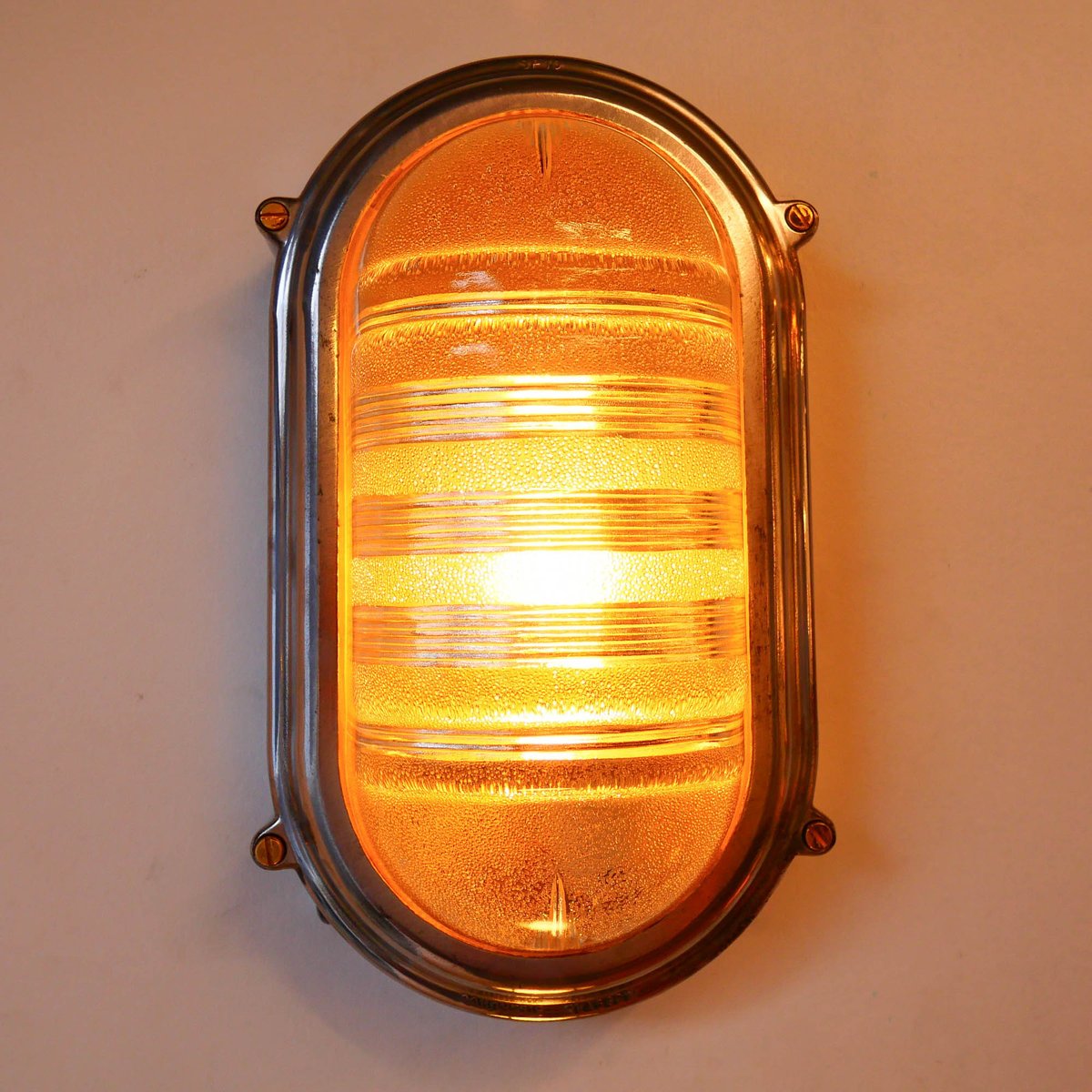 Wall Lamp in Polished Cast Aluminum and Worked Glass, 1950s