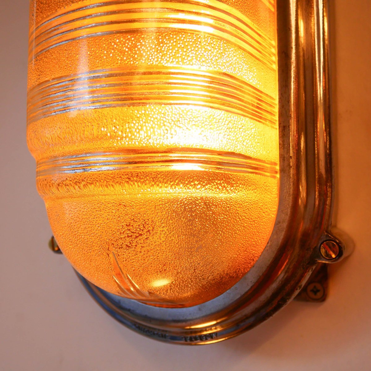 Wall Lamp in Polished Cast Aluminum and Worked Glass, 1950s