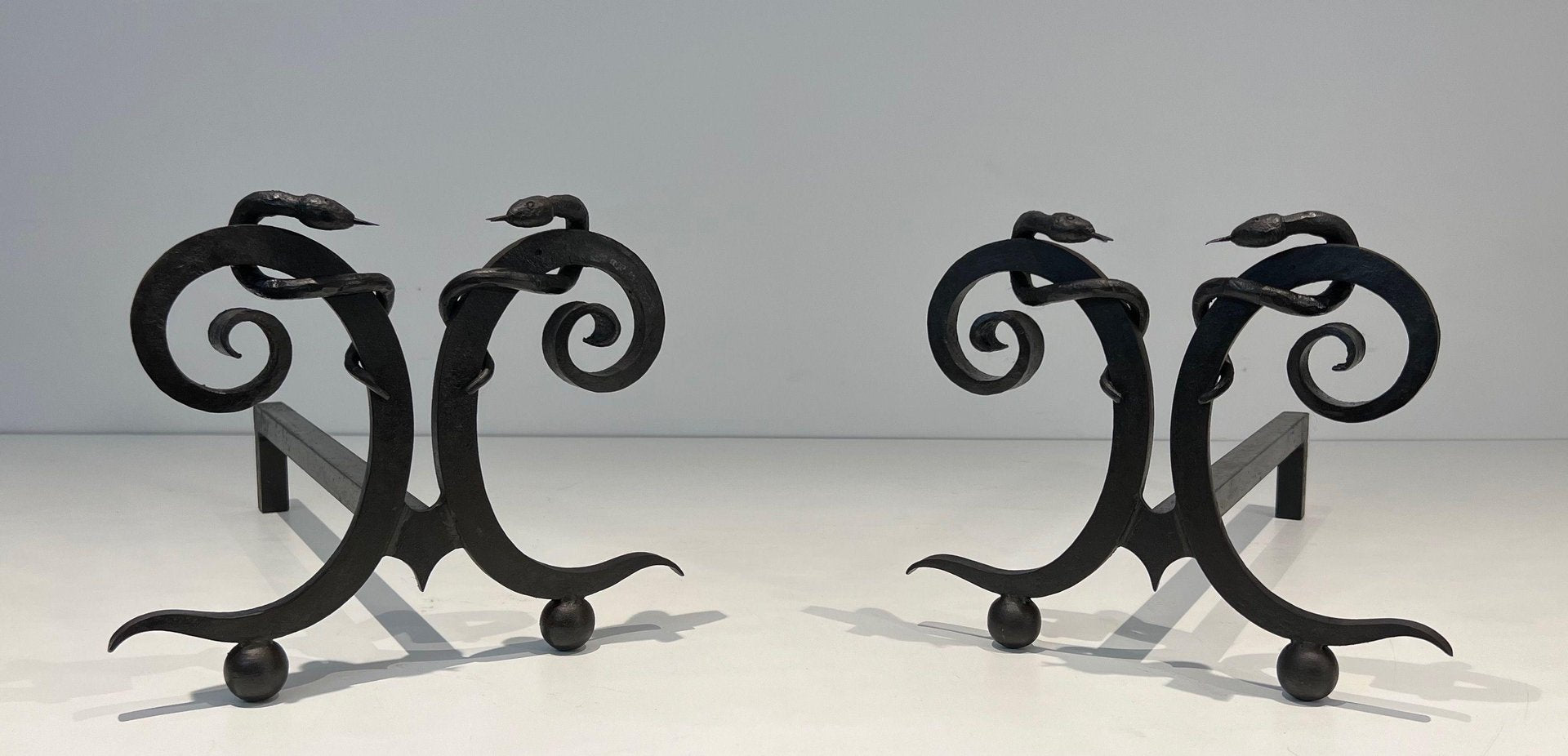 Wrought Iron Chenets with Snakes in the style of Edgar Brandt, 1950s, Set of 2