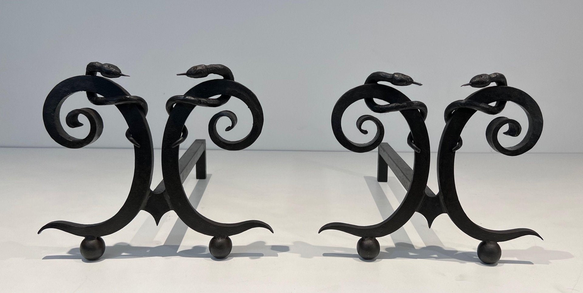 Wrought Iron Chenets with Snakes in the style of Edgar Brandt, 1950s, Set of 2