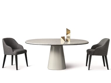 OWEN - Round natural stone dining table by Meridiani